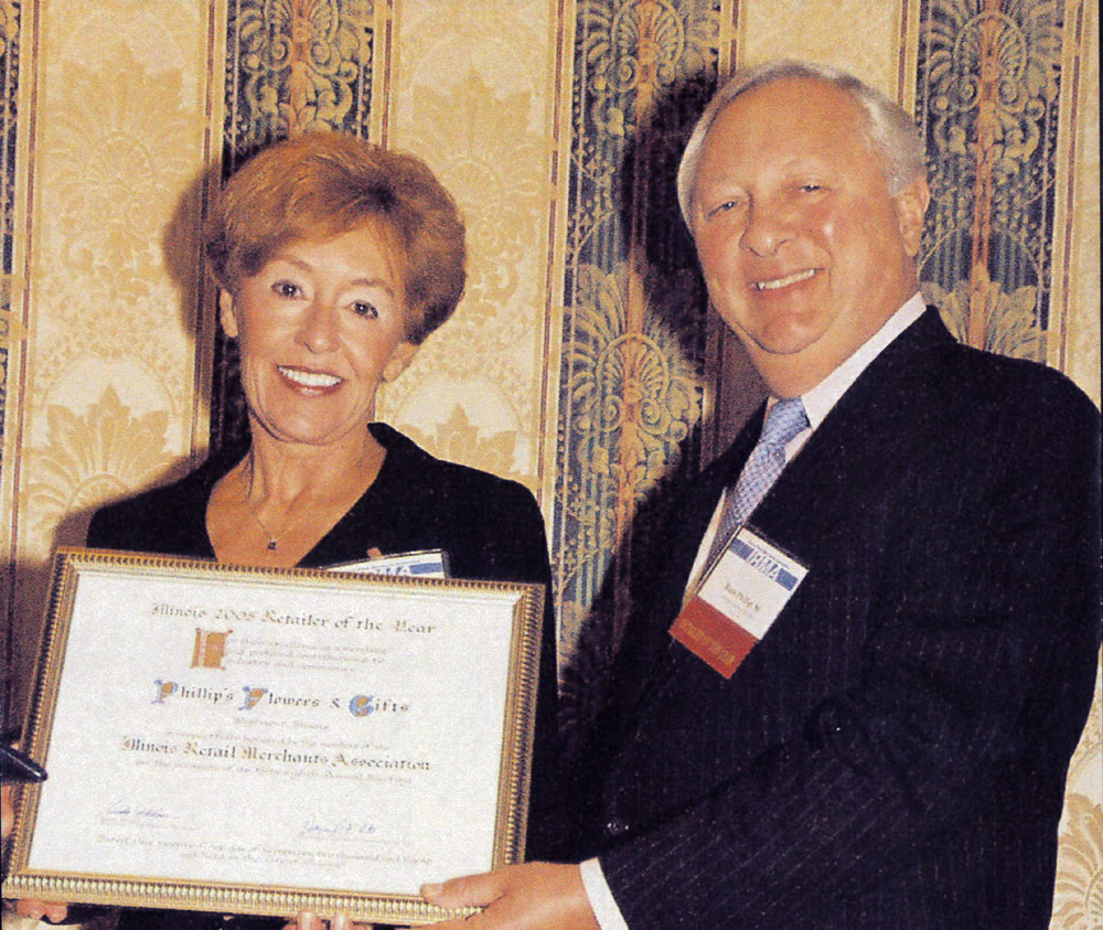 Lorelei and Russ Phillip accepting the Illinois Retail Merchant of the Year award in 2000